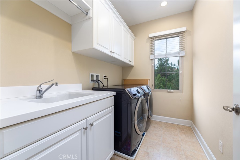 71 Thornapple Irvine, CA 92620 - Photo 26 of 33 a utility room with sink dryer and washer