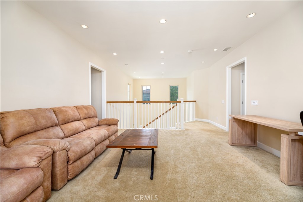 71 Thornapple Irvine, CA 92620 - Photo 27 of 33 a living room with furniture and a view of kitchen