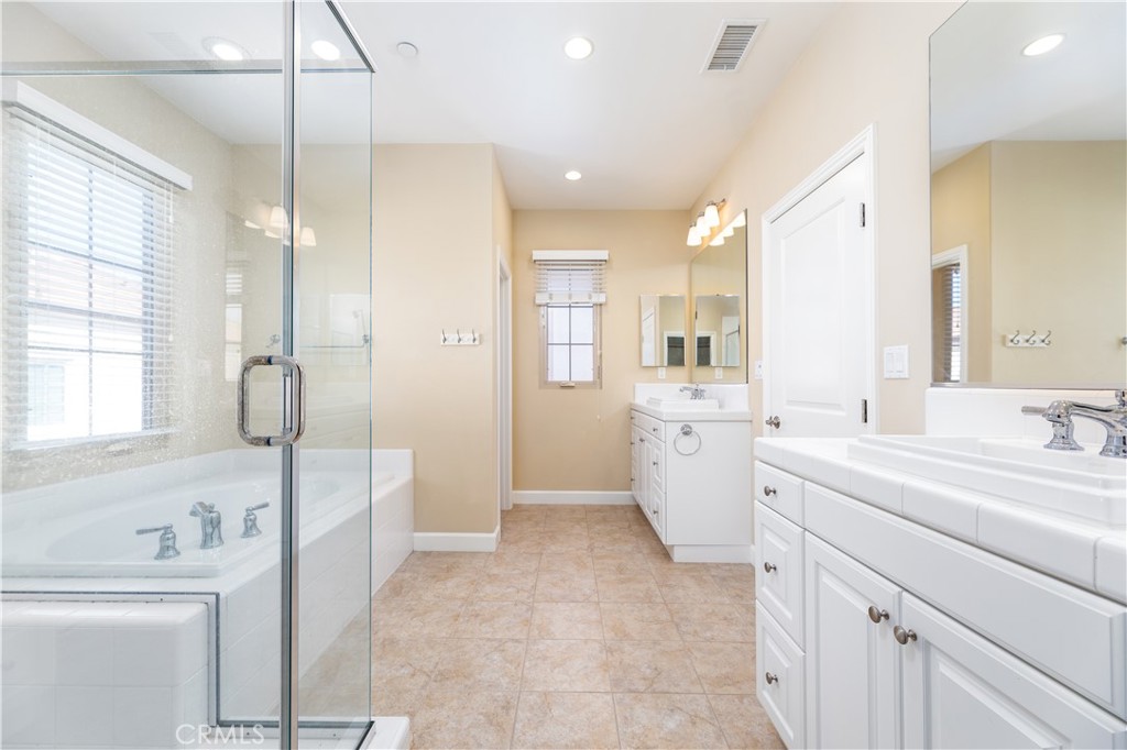 71 Thornapple Irvine, CA 92620 - Photo 3 of 33 a bathroom with a sink a toilet and a large mirror