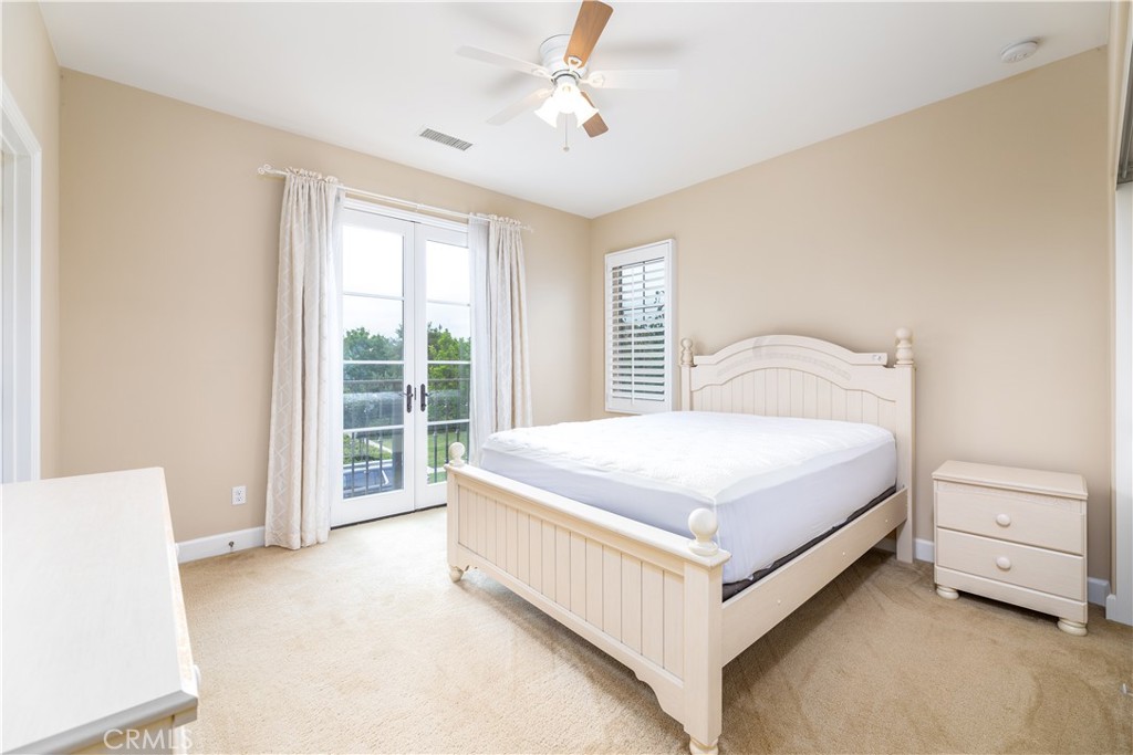71 Thornapple Irvine, CA 92620 - Photo 7 of 33 a bedroom with a bed and a large window