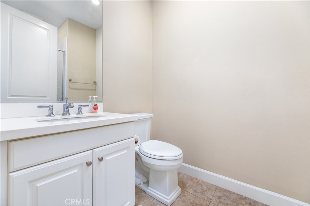 71 Thornapple Irvine, CA 92620 - Photo 8 of 33 a bathroom with a sink a toilet and a mirror