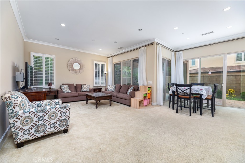 71 Thornapple Irvine, CA 92620 - Photo 10 of 33 a living room with furniture and a large window