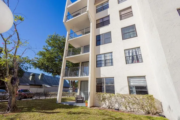 a view of a kitchen with cabinets