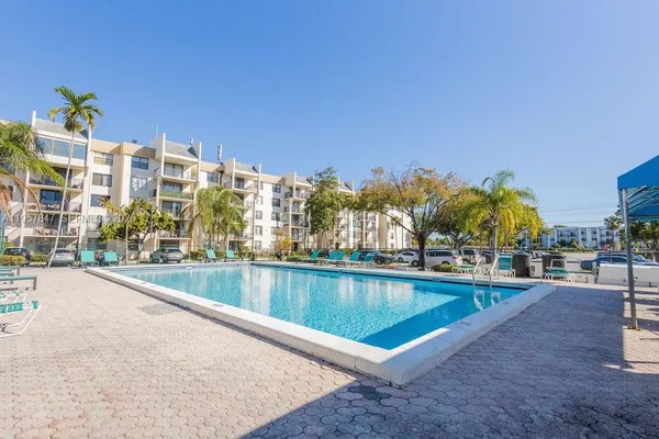 a view of a swimming pool with a patio