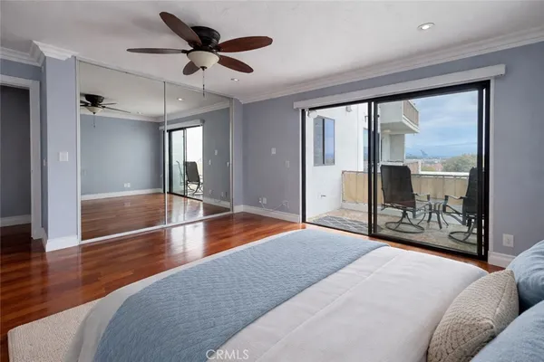 a living room with large window with a chandelier