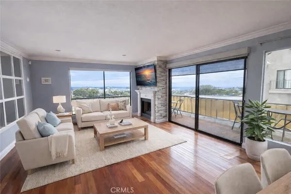 a living room with furniture fireplace and flat screen tv