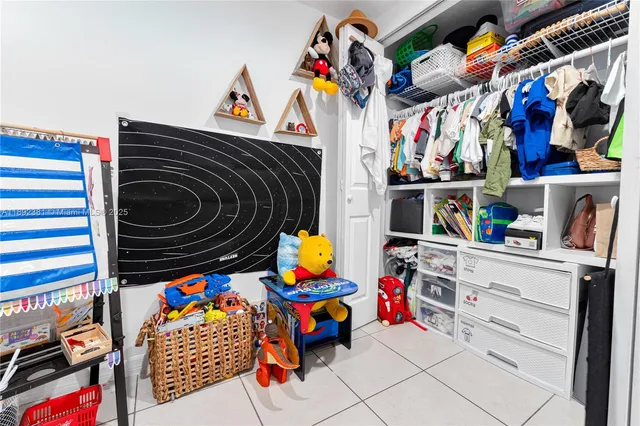 a utility room with lots of stuff and dryer