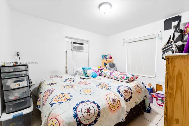 a bedroom with a bed and a closet