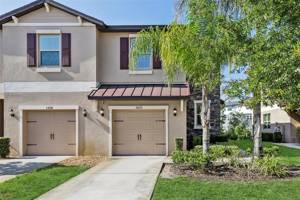 front view of a house with a yard