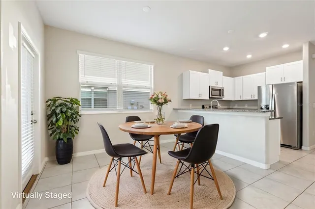a view of a kitchen with a sink and a chandelier fan