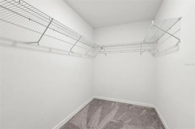 an empty room with a ceiling fan and a ceiling fan