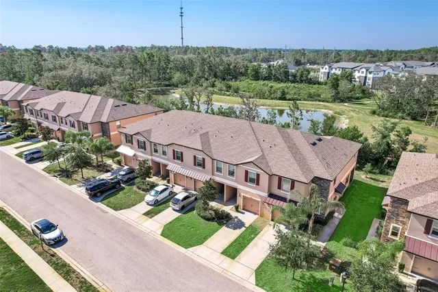 an aerial view of residential houses with outdoor space