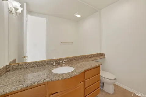 a view of staircase with railing and white walls