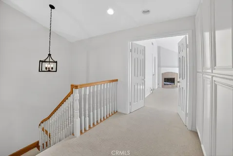 a view of a balcony with wooden floor and fence