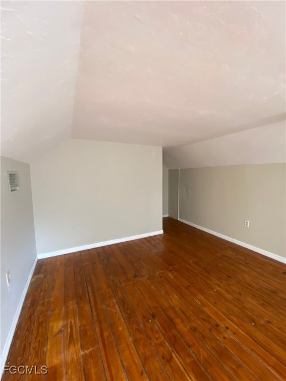 2210 Cantor Lane, Unit B North Fort Myers, FL 33917 - Photo 4 of 9 a view of empty room with wooden floor