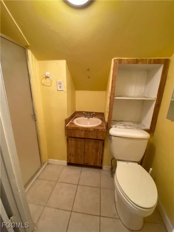 2210 Cantor Lane, Unit B North Fort Myers, FL 33917 - Photo 8 of 9 a bathroom with a toilet and a shower