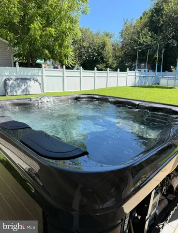 a view of a backyard with swimming pool