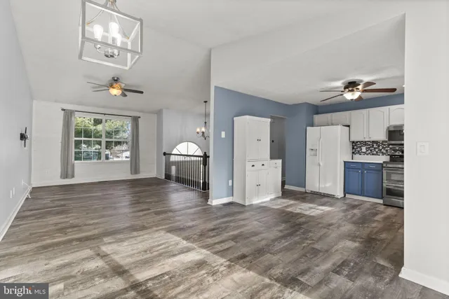 a view of a kitchen with furniture and a window
