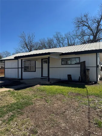 a house view with a backyard space