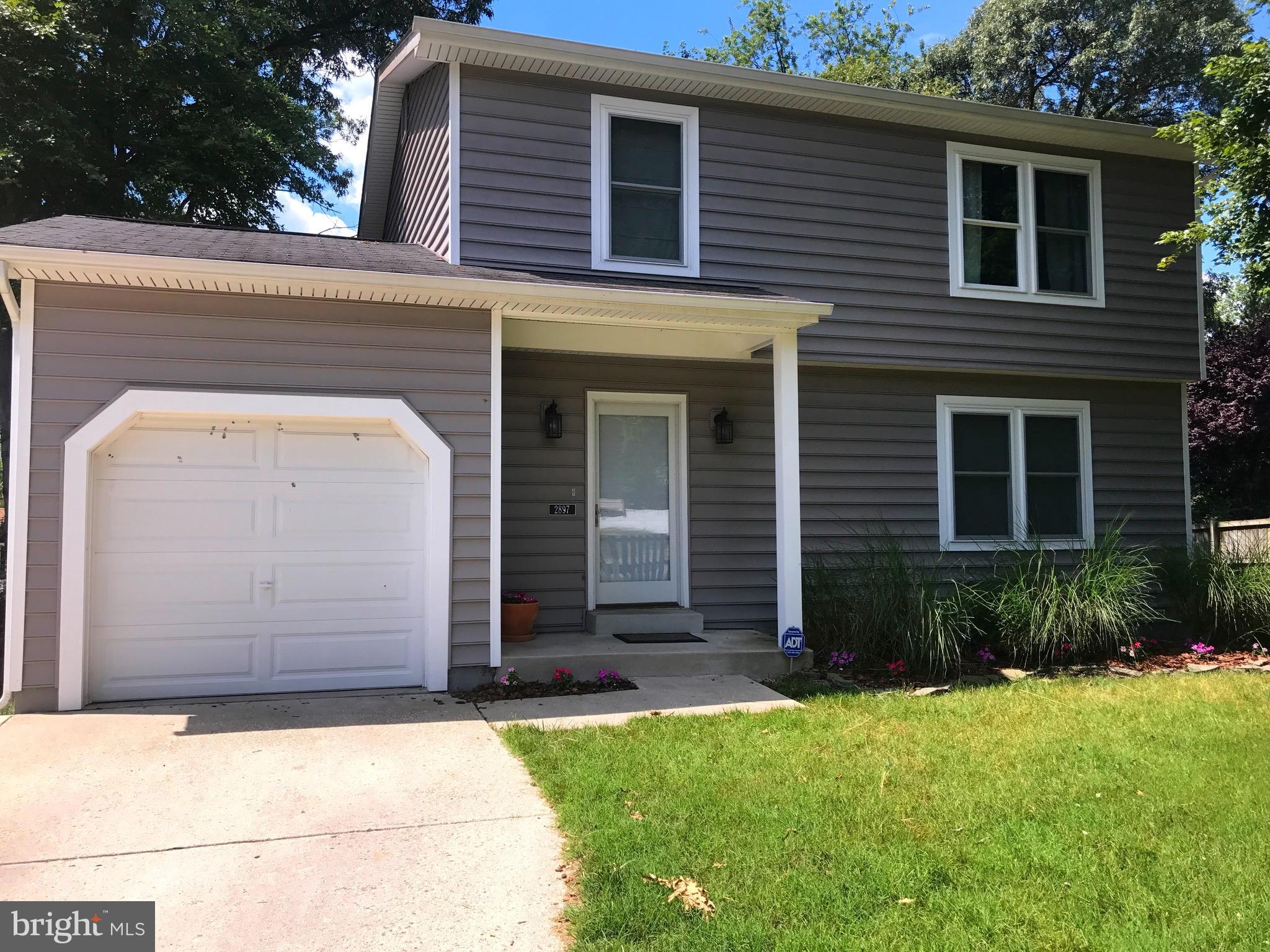 2897 Dungate Road Pasadena, MD 21122 - Photo 1 of 30 a front view of a house with garden