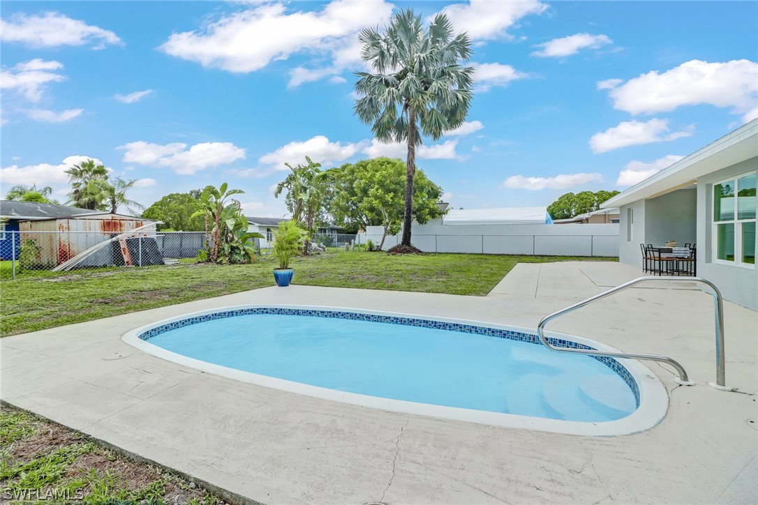 112 Rowland Road Lehigh Acres, FL 33936 - Photo 19 of 22 a view of a swimming pool and outdoor space