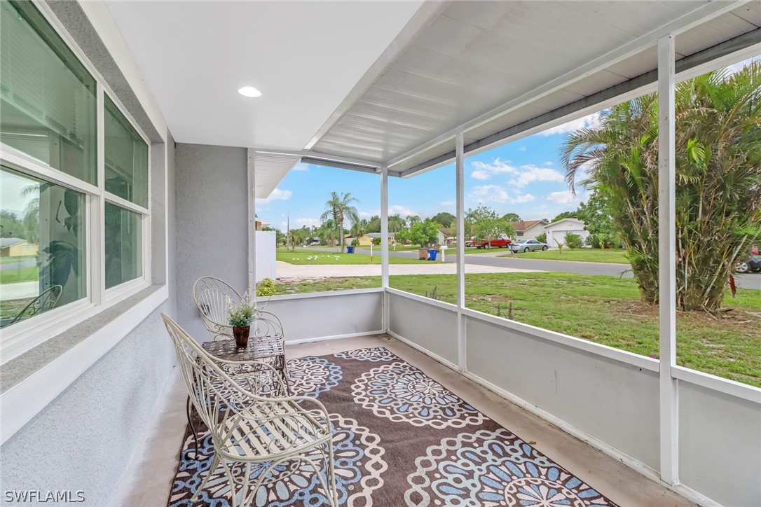 112 Rowland Road Lehigh Acres, FL 33936 - Photo 2 of 22 a view of a porch with furniture and yard