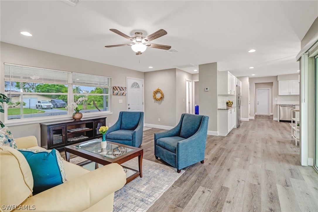 112 Rowland Road Lehigh Acres, FL 33936 - Photo 4 of 22 a living room with furniture and a large window
