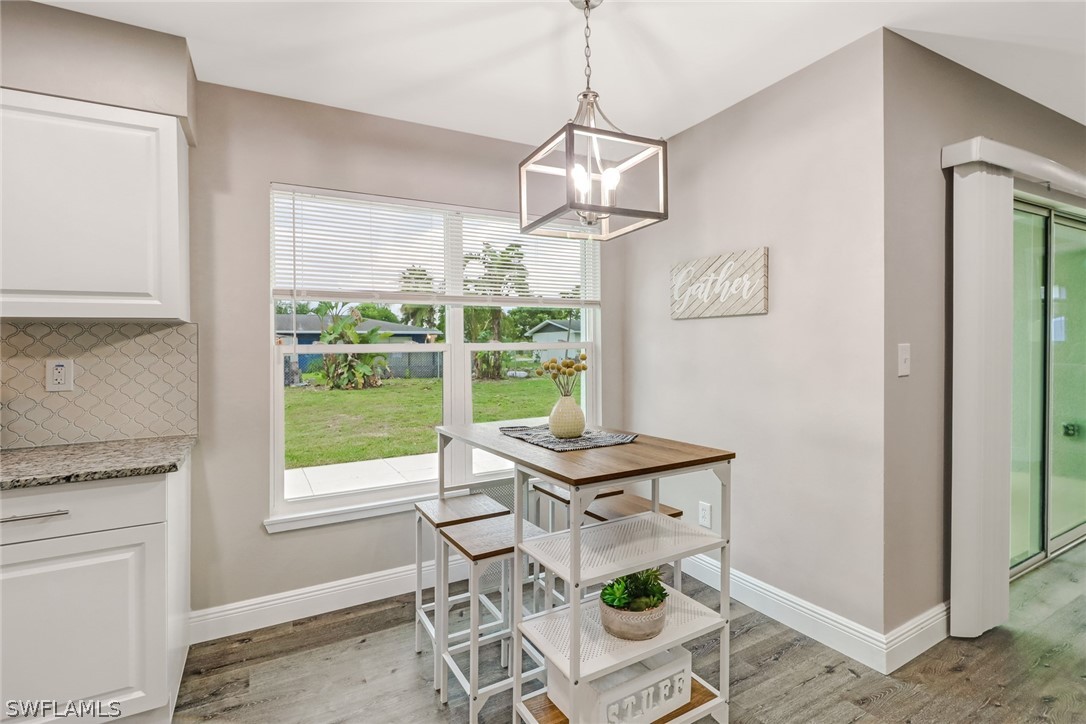 112 Rowland Road Lehigh Acres, FL 33936 - Photo 7 of 22 a room with furniture and window