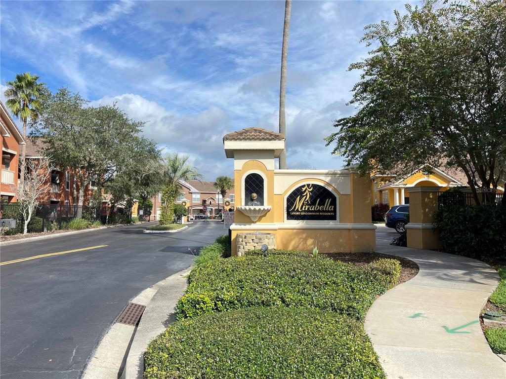 8849 Villa View Circle, Unit 206 Orlando, FL 32821 - Photo 16 of 19 a front view of a house with a yard