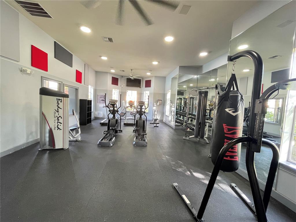 8849 Villa View Circle, Unit 206 Orlando, FL 32821 - Photo 19 of 19 a view of a room with gym equipment