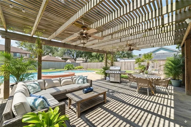 a view of a big yard in front of a brick house with plants