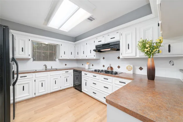 a bathroom with a bathtub and a sink