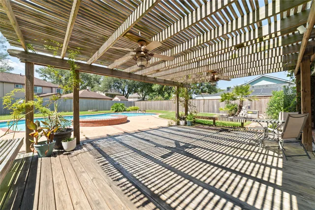 a view of swimming pool with a chairs
