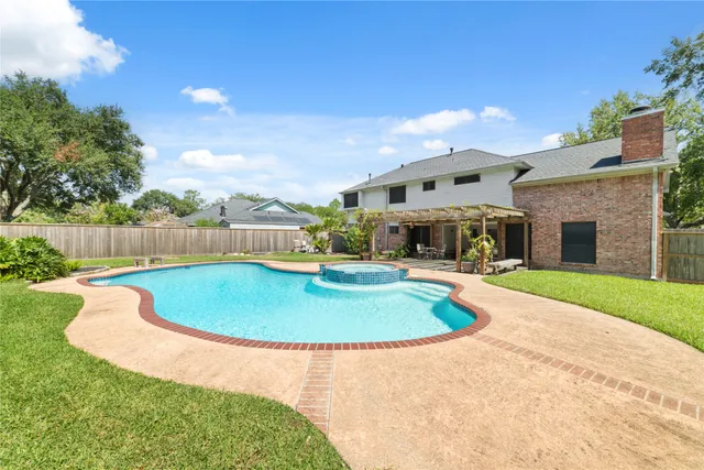 a view of empty room with wooden floor and fireplace