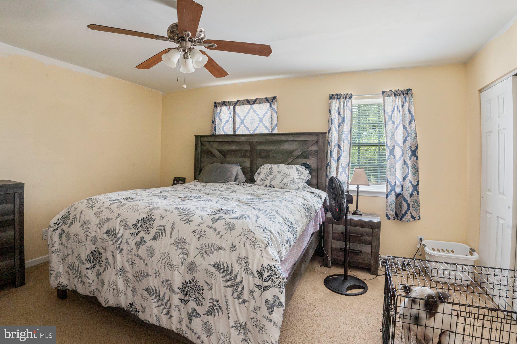120 Danford Drive Elkton, MD 21921 - Photo 11 of 25 a bedroom with a bed and a chandelier