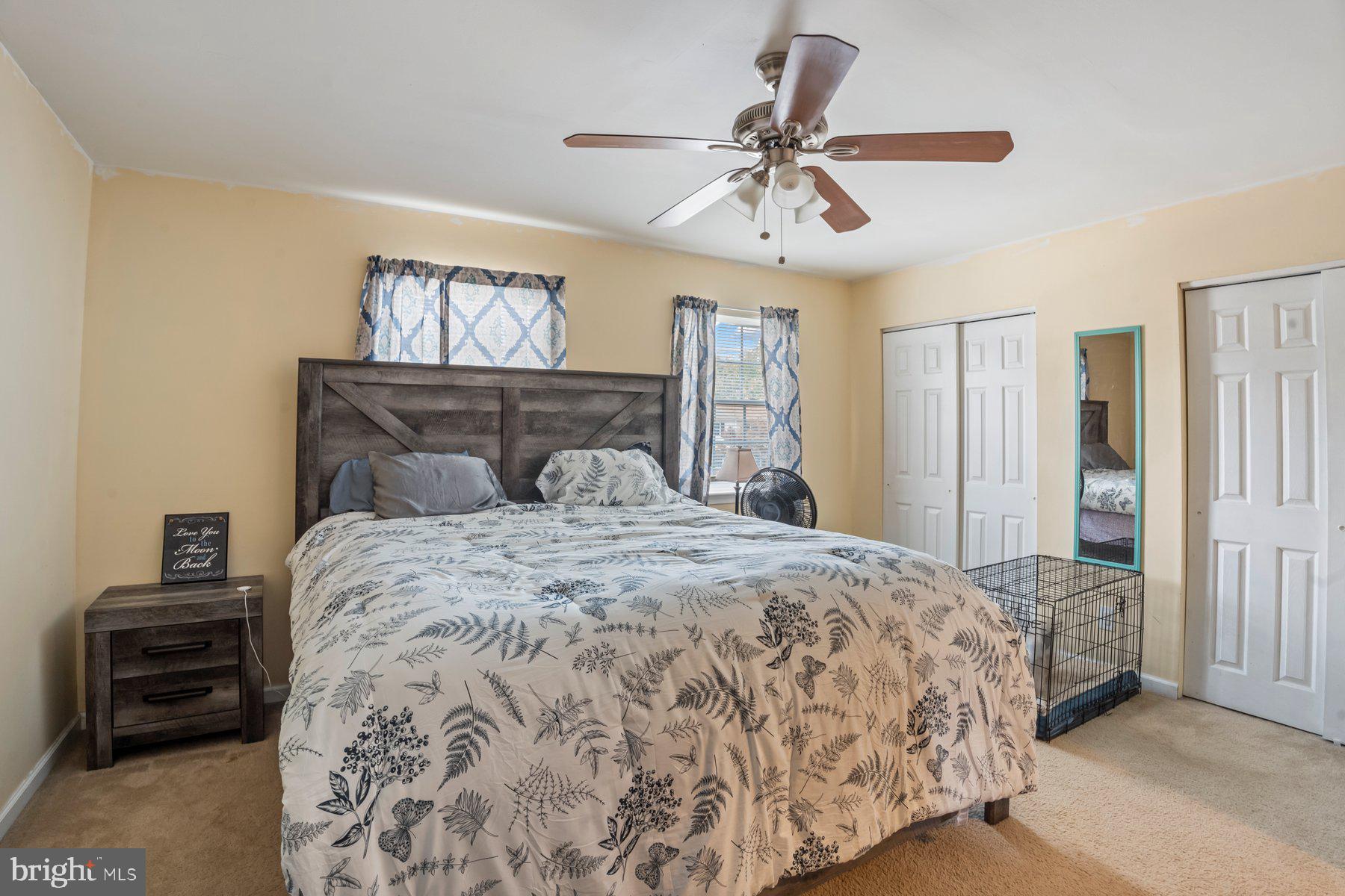 120 Danford Drive Elkton, MD 21921 - Photo 19 of 25 a bedroom with a large bed and a chandelier