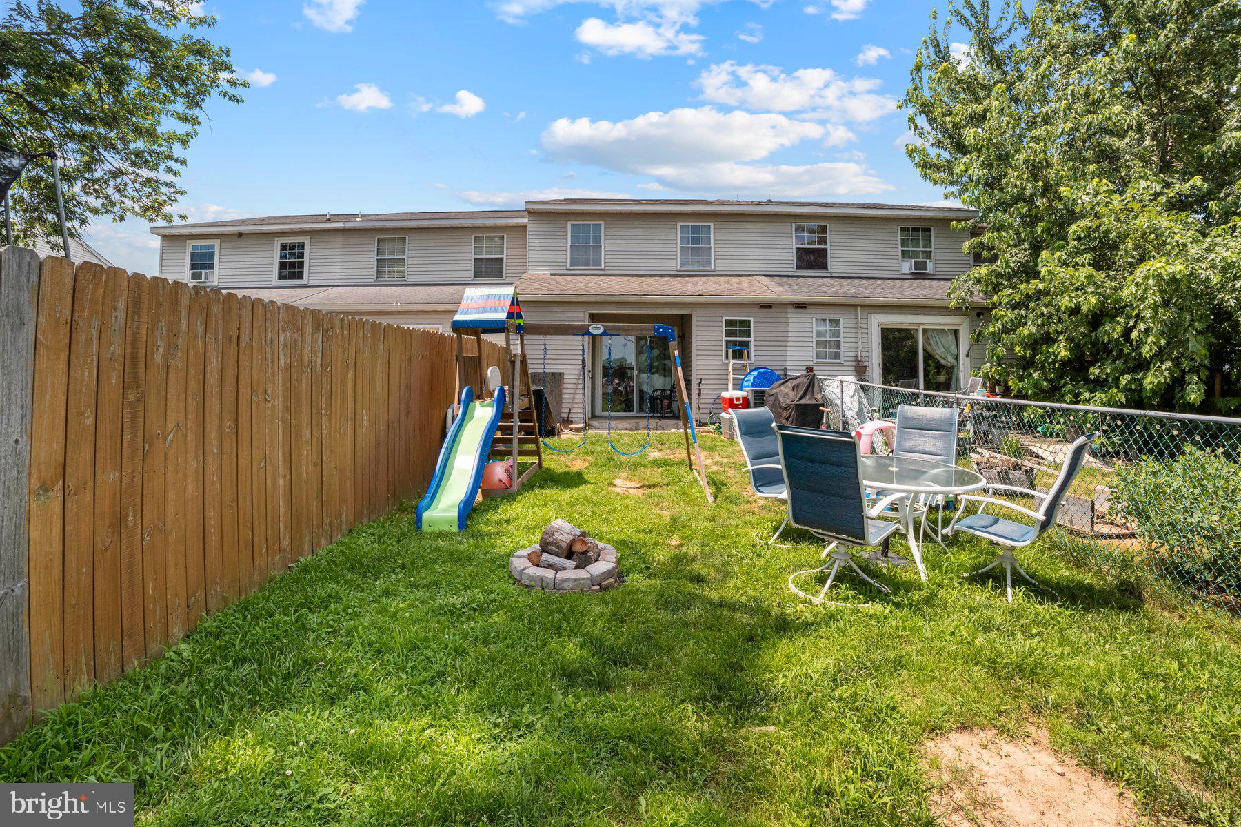 120 Danford Drive Elkton, MD 21921 - Photo 23 of 25 a view of a backyard with a patio and fire pit