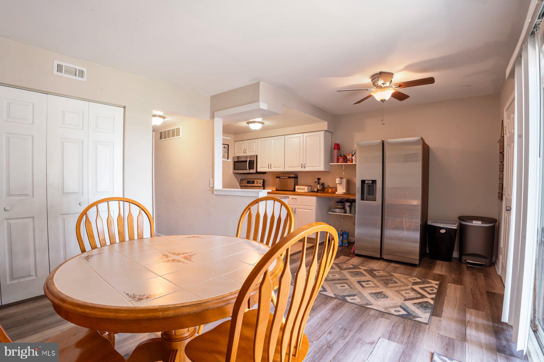 120 Danford Drive Elkton, MD 21921 - Photo 6 of 25 a dining room with furniture a chandelier and wooden floor