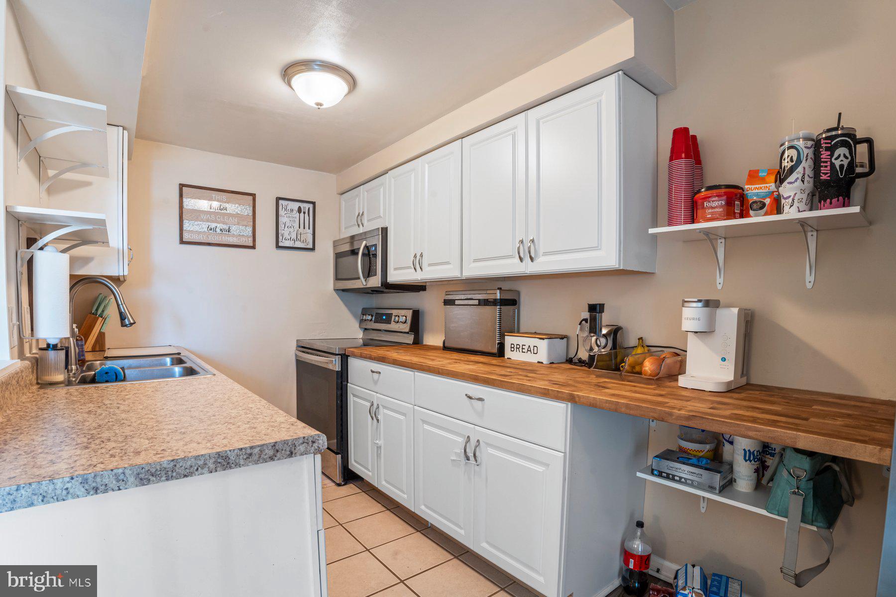 120 Danford Drive Elkton, MD 21921 - Photo 8 of 25 a kitchen with granite countertop a sink dishwasher stove and cabinets