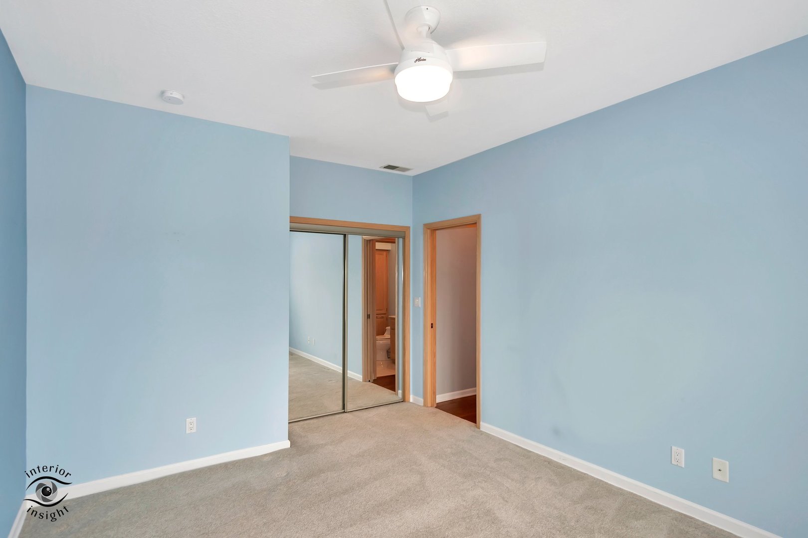 891 Exeter Turn, Unit A2 Bourbonnais, IL 60914 - Photo 14 of 29 an empty room with a ceiling fan and a window
