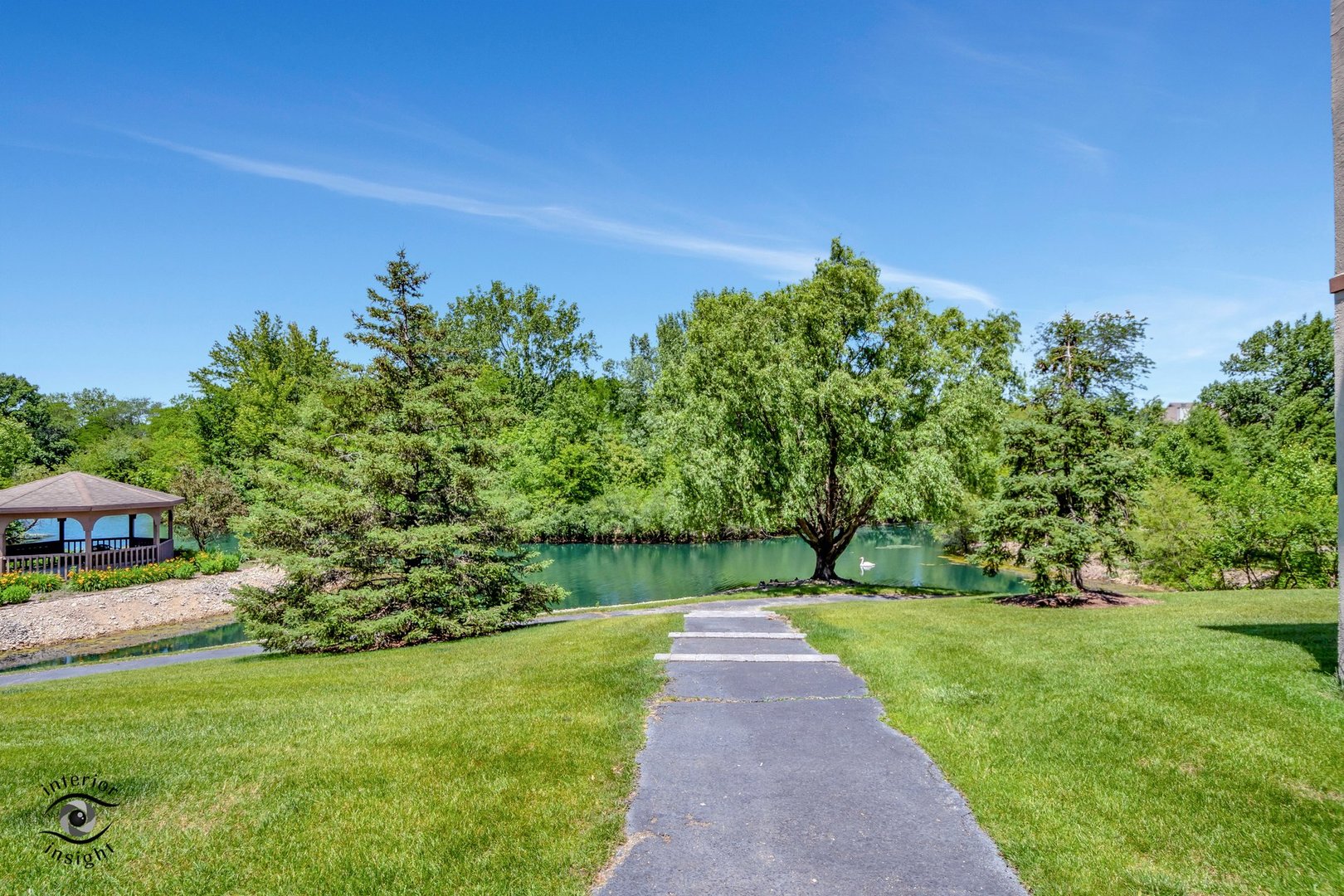 891 Exeter Turn, Unit A2 Bourbonnais, IL 60914 - Photo 27 of 29 a view of a garden with a house in the background