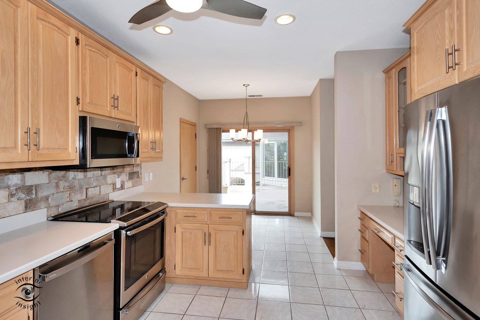 891 Exeter Turn, Unit A2 Bourbonnais, IL 60914 - Photo 7 of 29 a kitchen with a sink stove and refrigerator