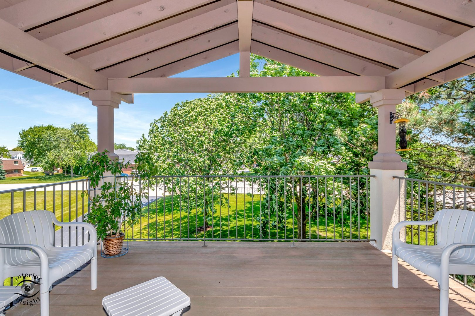 891 Exeter Turn, Unit A2 Bourbonnais, IL 60914 - Photo 8 of 29 a view of a patio with couches under an umbrella