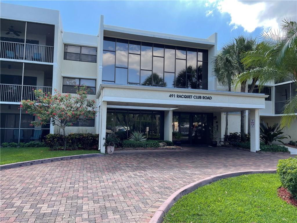 491 Racquet Club Road, Unit 109 Weston, FL 33326 - Photo 1 of 39 a house view with a garden space