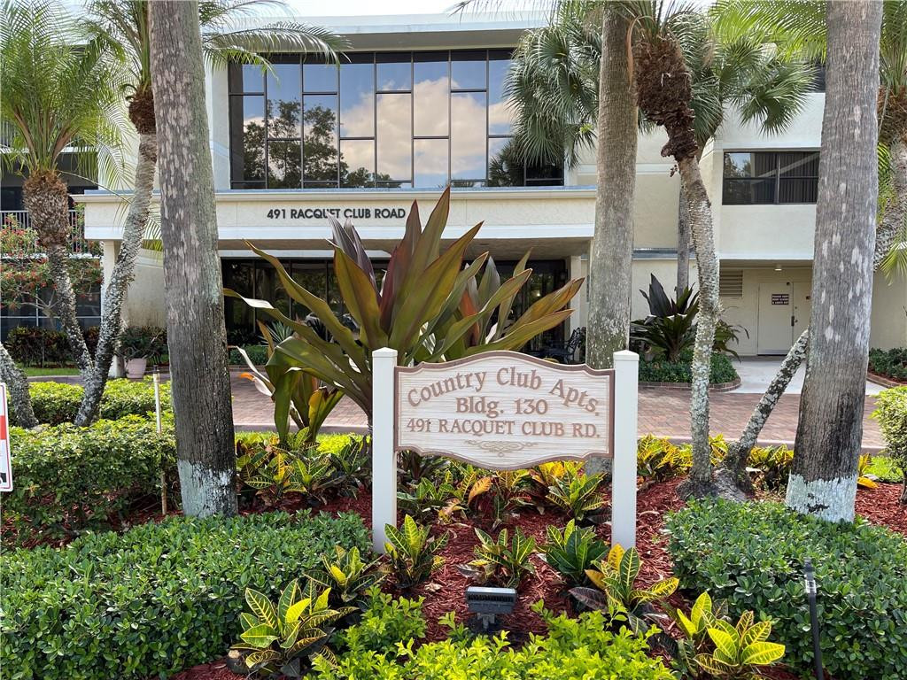 491 Racquet Club Road, Unit 109 Weston, FL 33326 - Photo 2 of 39 a sign on the side of a building
