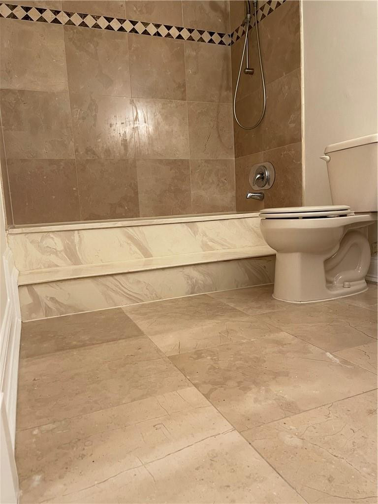 491 Racquet Club Road, Unit 109 Weston, FL 33326 - Photo 23 of 39 a bathroom with a shower and a toilet