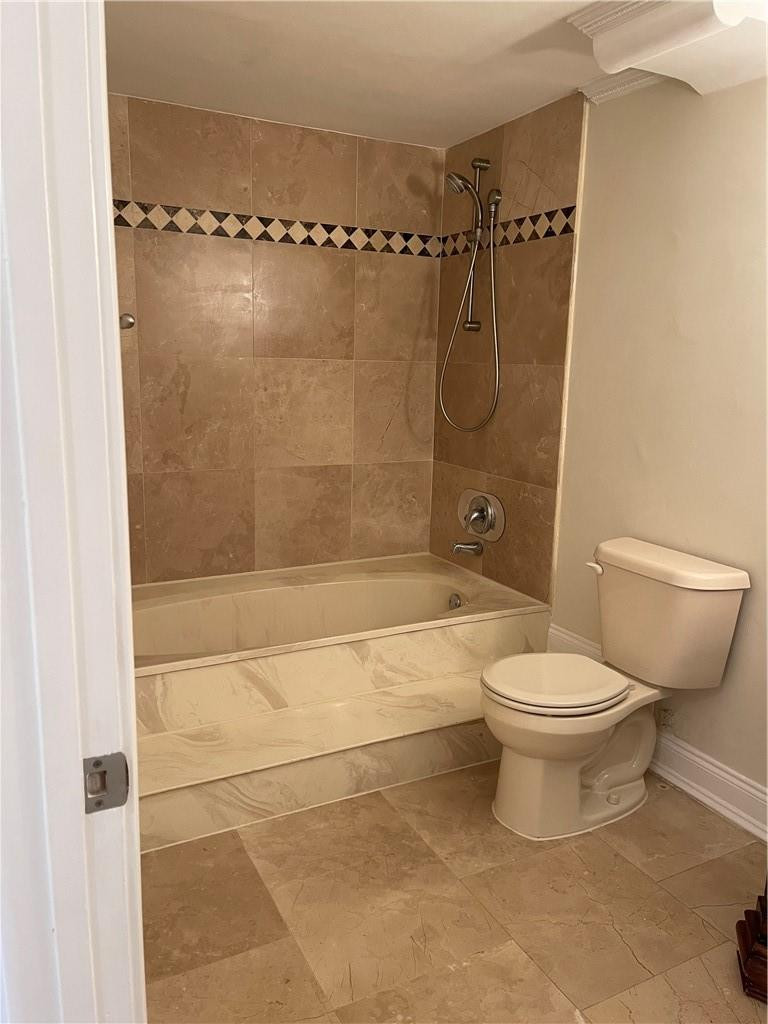 491 Racquet Club Road, Unit 109 Weston, FL 33326 - Photo 24 of 39 a bathroom with a toilet and shower
