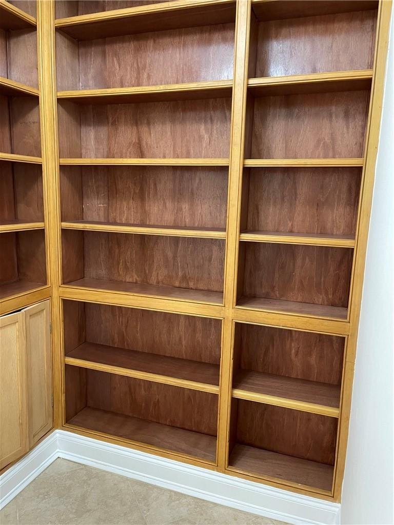 491 Racquet Club Road, Unit 109 Weston, FL 33326 - Photo 26 of 39 a view of walk in closet with empty racks