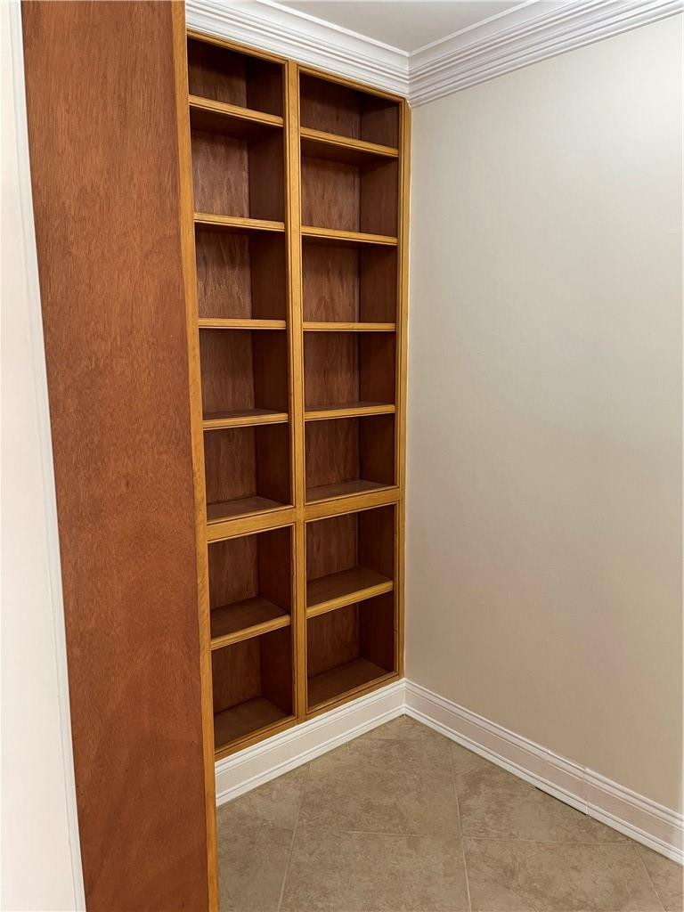 491 Racquet Club Road, Unit 109 Weston, FL 33326 - Photo 27 of 39 a view of an empty room and empty shelves