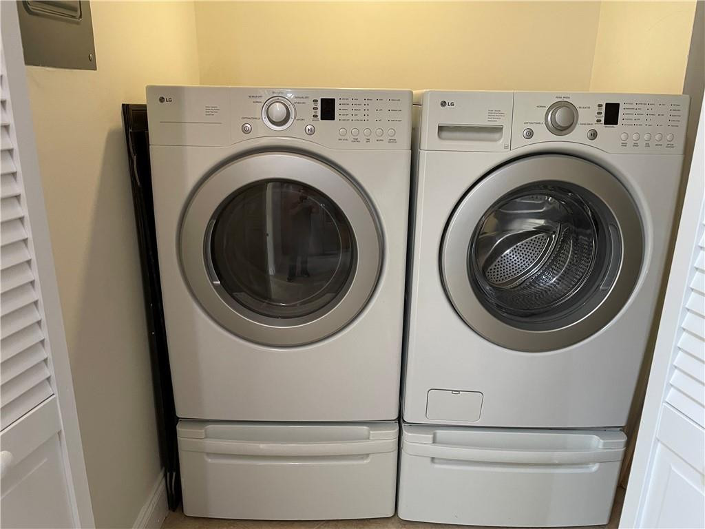 491 Racquet Club Road, Unit 109 Weston, FL 33326 - Photo 37 of 39 a utility room with dryer and washer